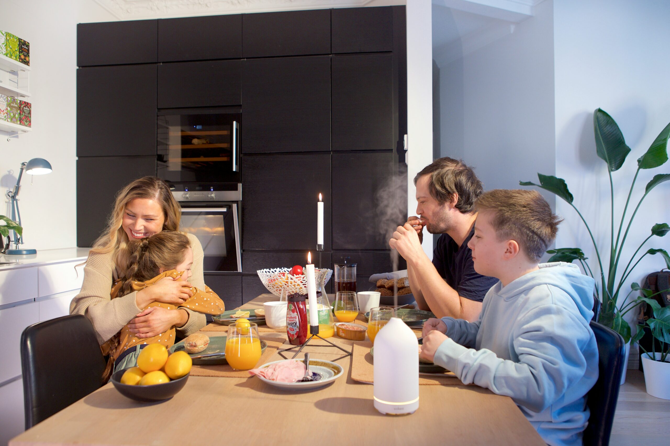 A family eats at a table.