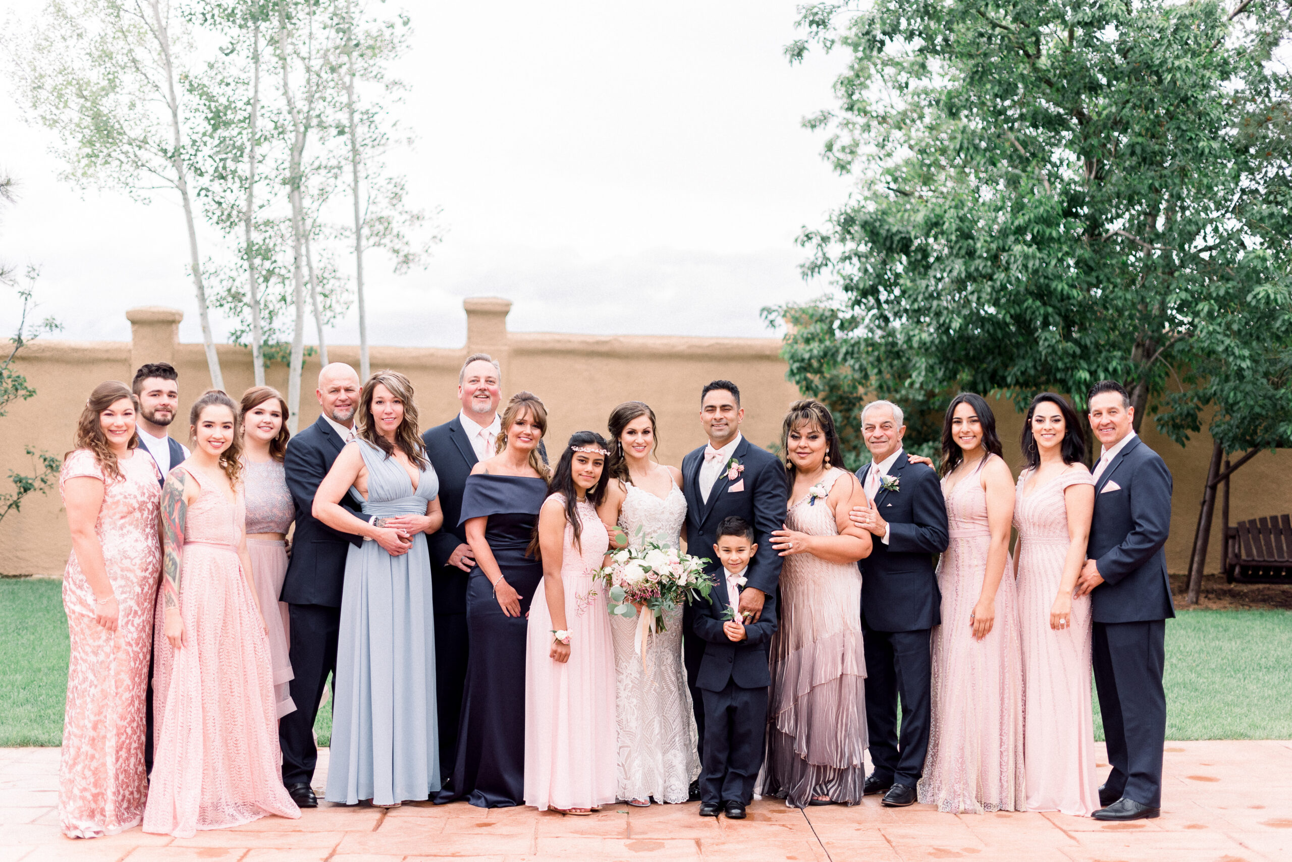 A blended family in a wedding portrait.