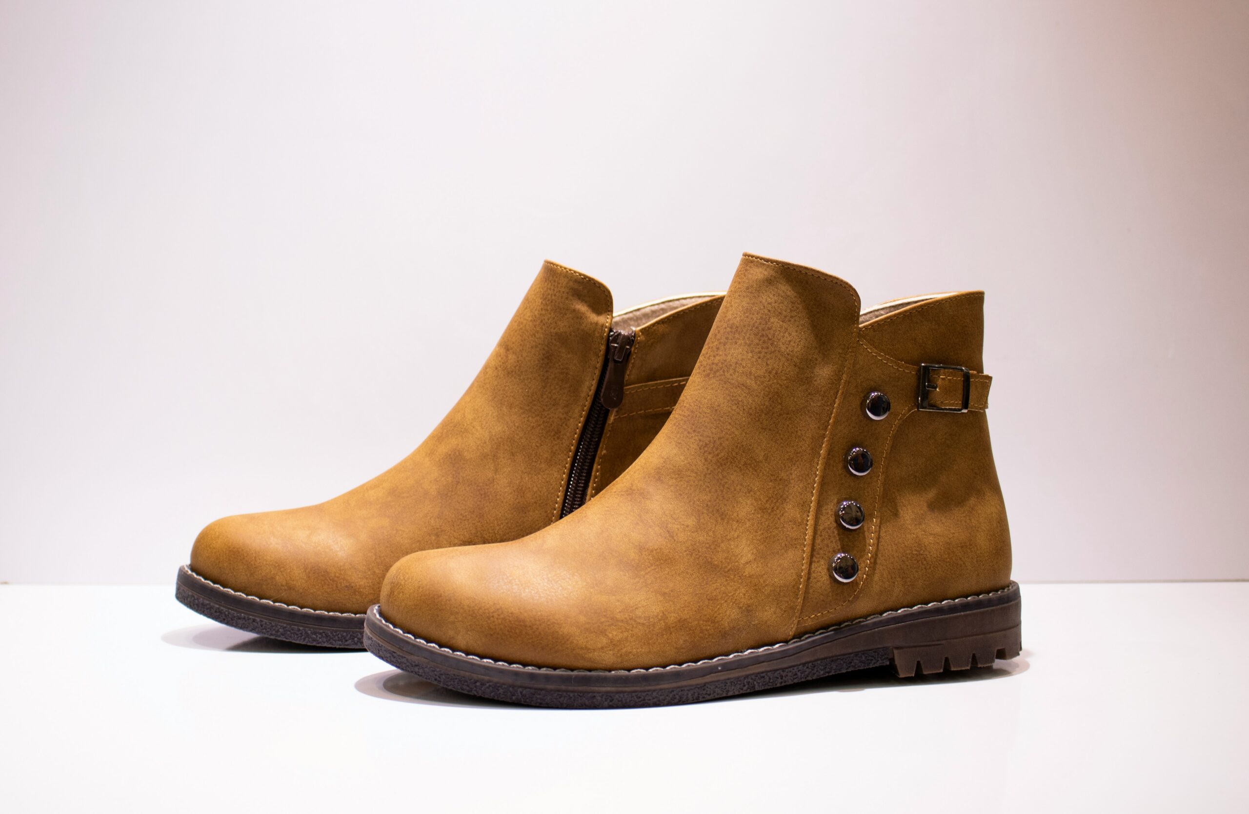 A pair of brown ankle boots.